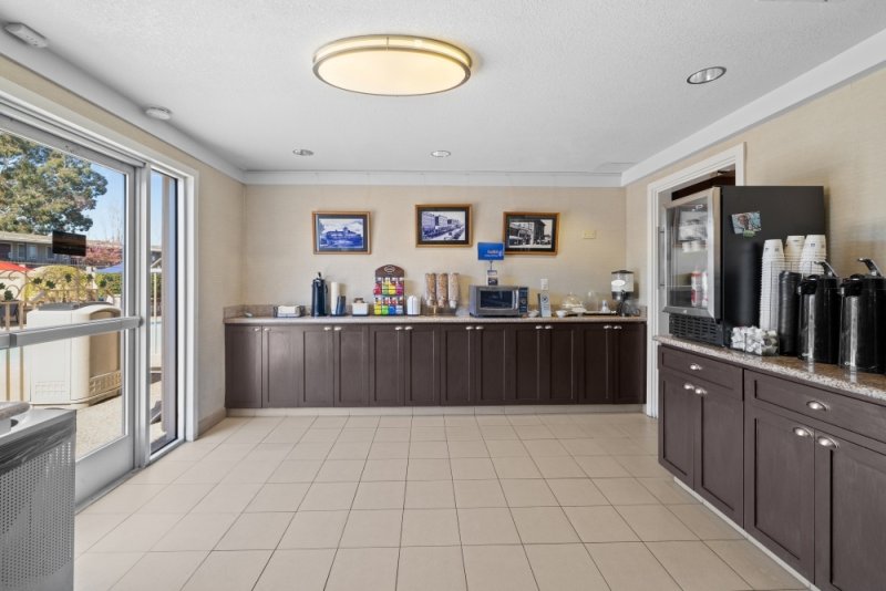 Bright breakfast area with refreshments available.