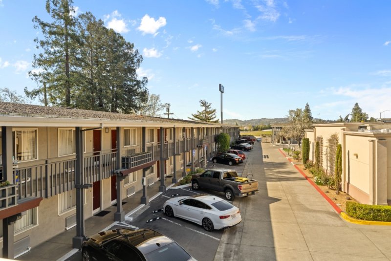 Motel exterior with parked cars