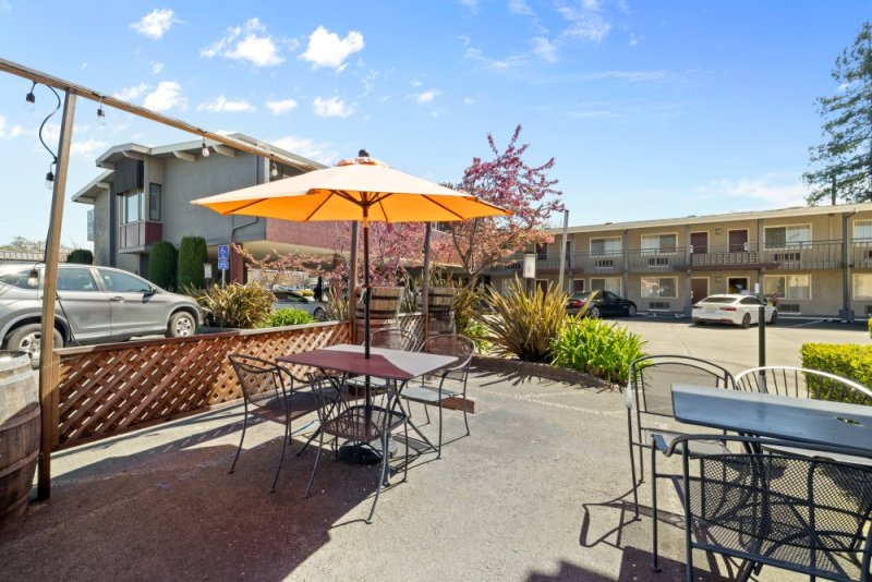 Outdoor seating with orange umbrella