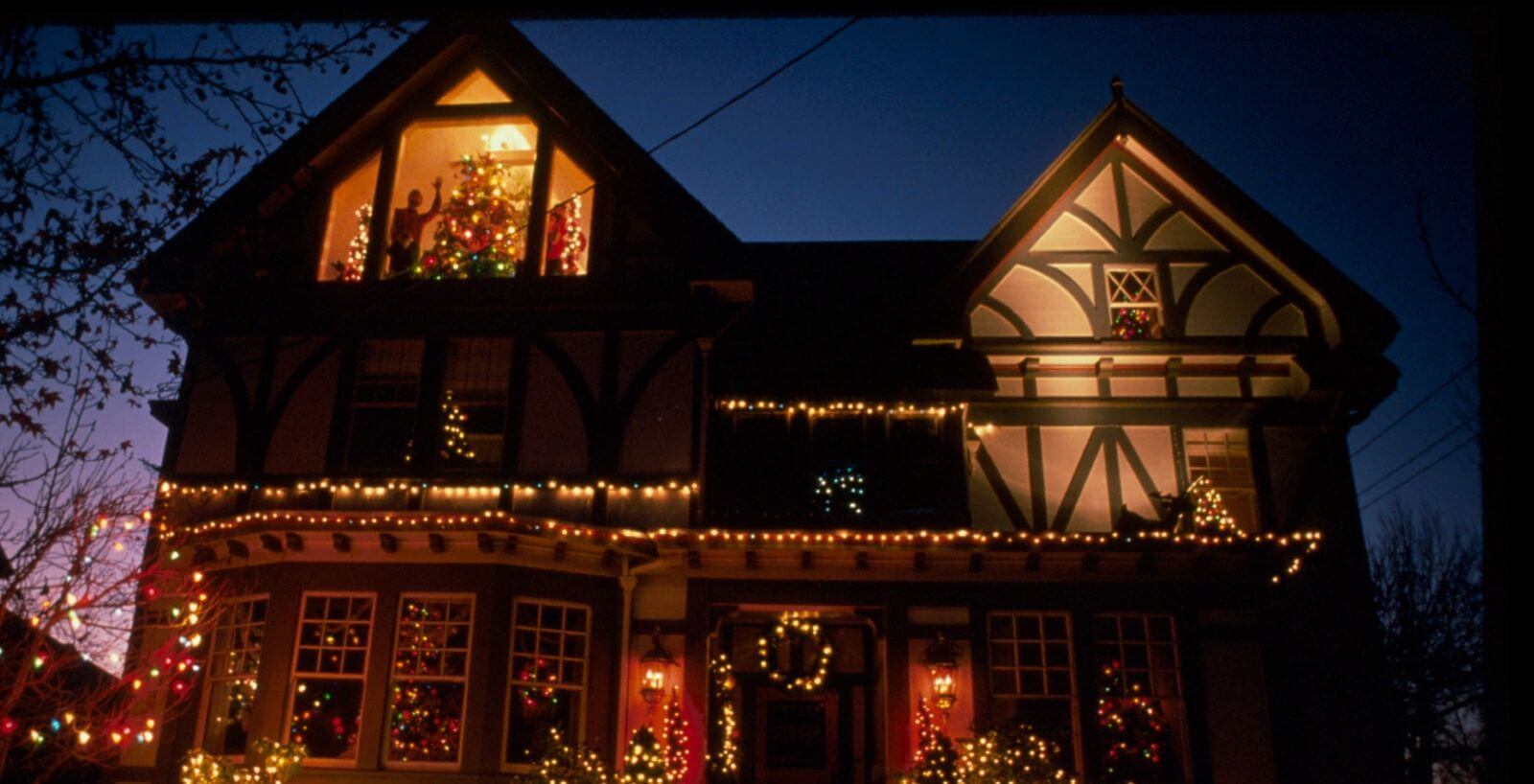 Festively decorated house at night