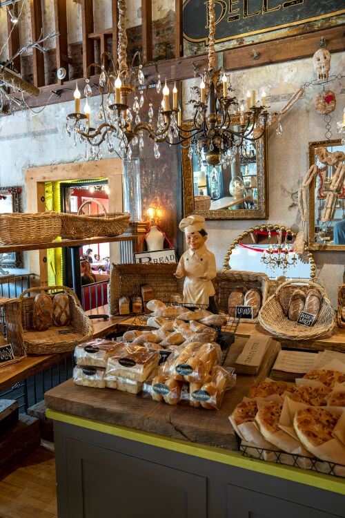 Bakery with chandeliers and a small baker statue