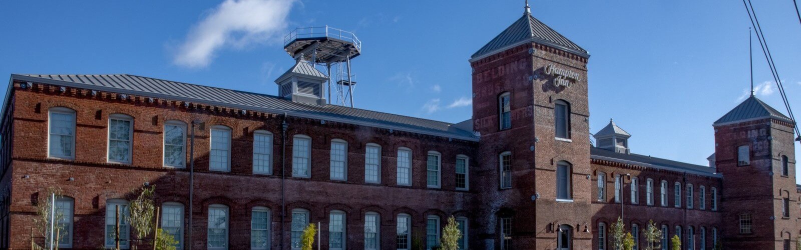 Where to stay 1 Historic hotel with observation tower behind on sunny day