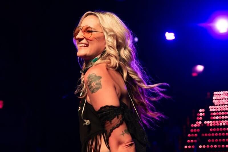 Smiling woman performing on stage