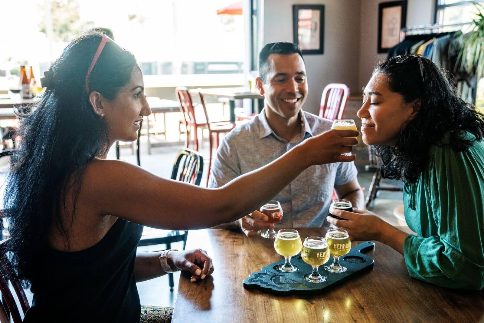 People enjoying craft beer tasting.