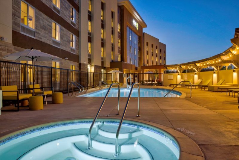 Pool and hot tub at dusk - home2 suites
