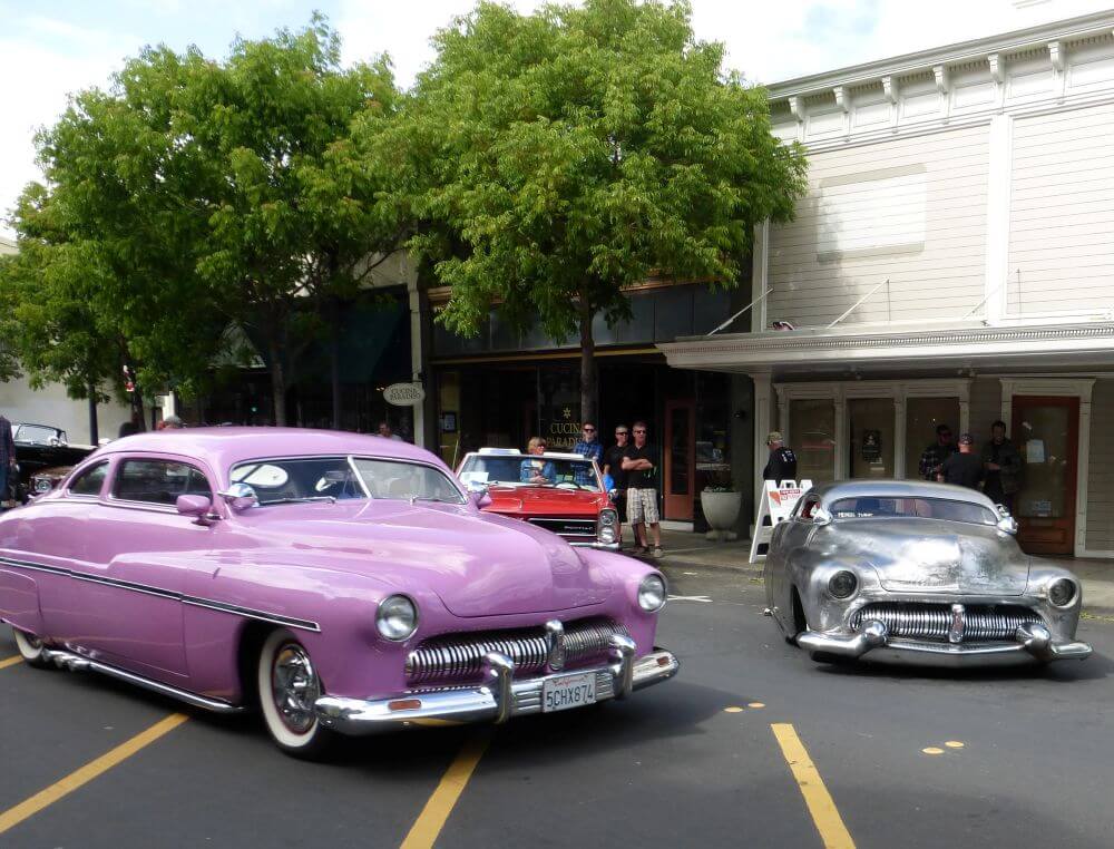 Classic cars, one pink, one silver