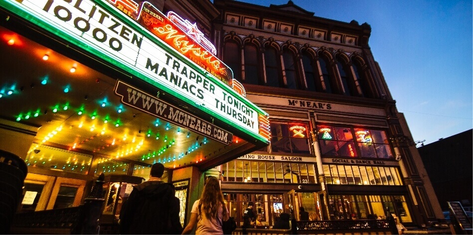 Large marquis and historic McNear's building at night.