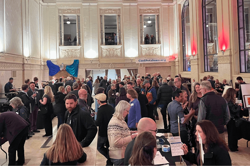 Crowded event in an elegant venue.