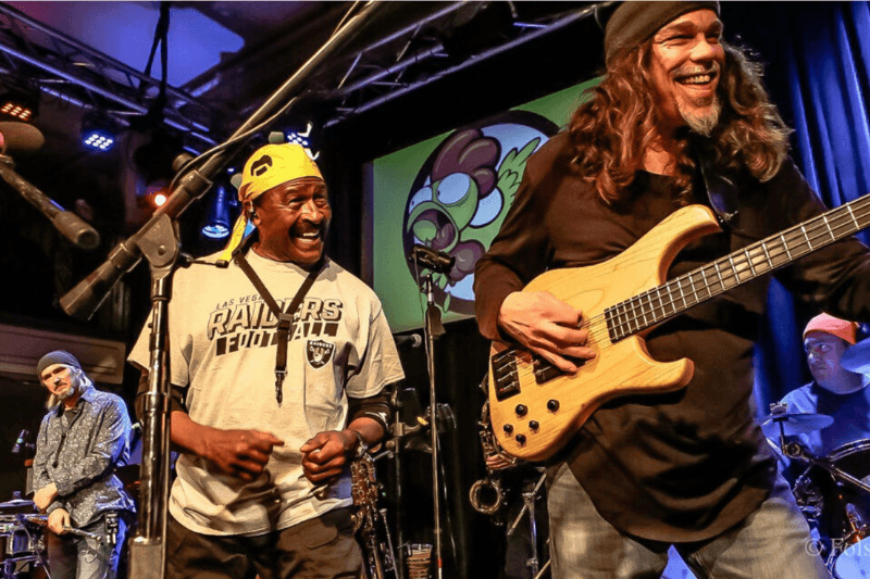 Musicians performing energetically on stage