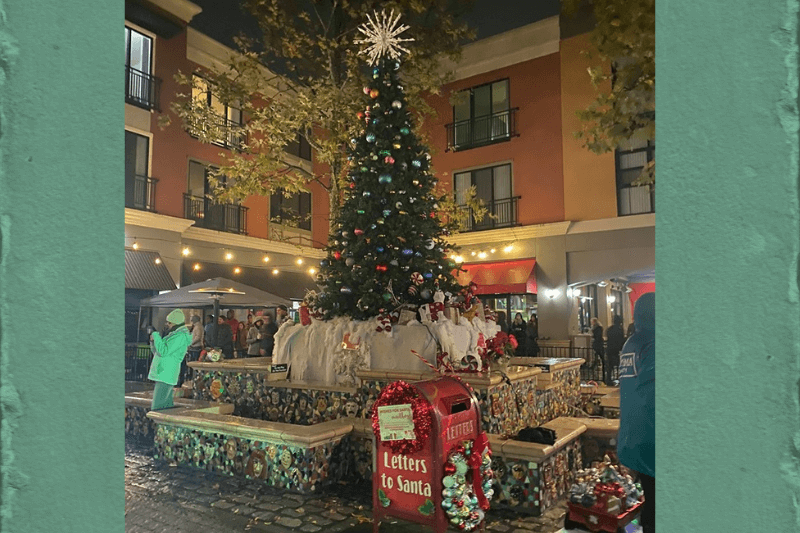 Best place for a weekend getaway in december 3 Decorated tree in middle of square with letters to santa mailbox in front of it.
