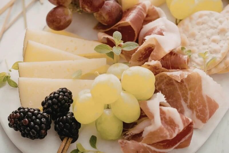Cheese, fruits, and cured meats platter