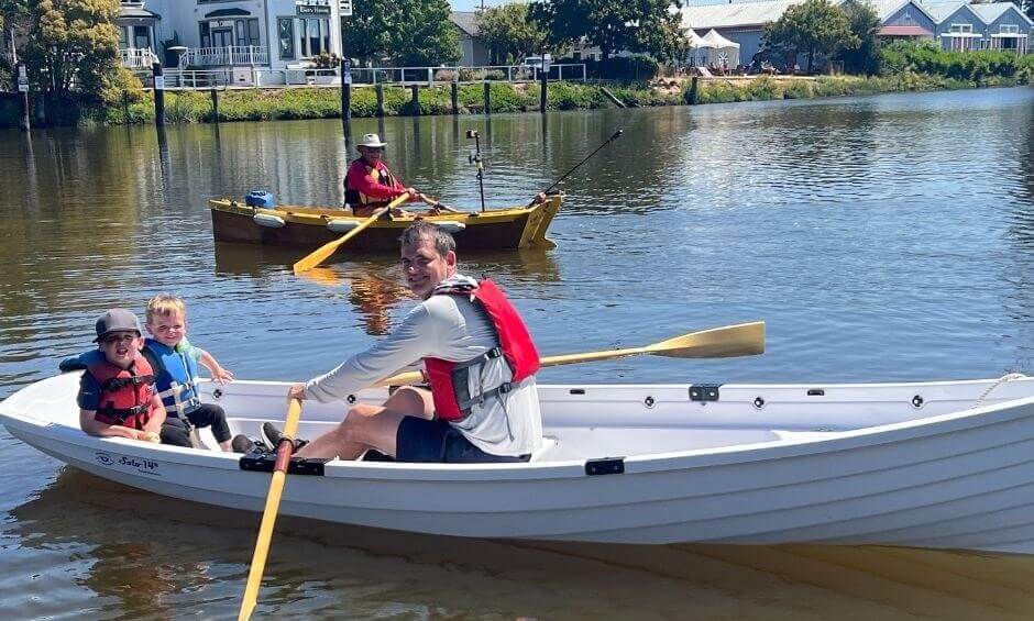 Family vacation, petaluma style! 7 Two kids rowing on a lake