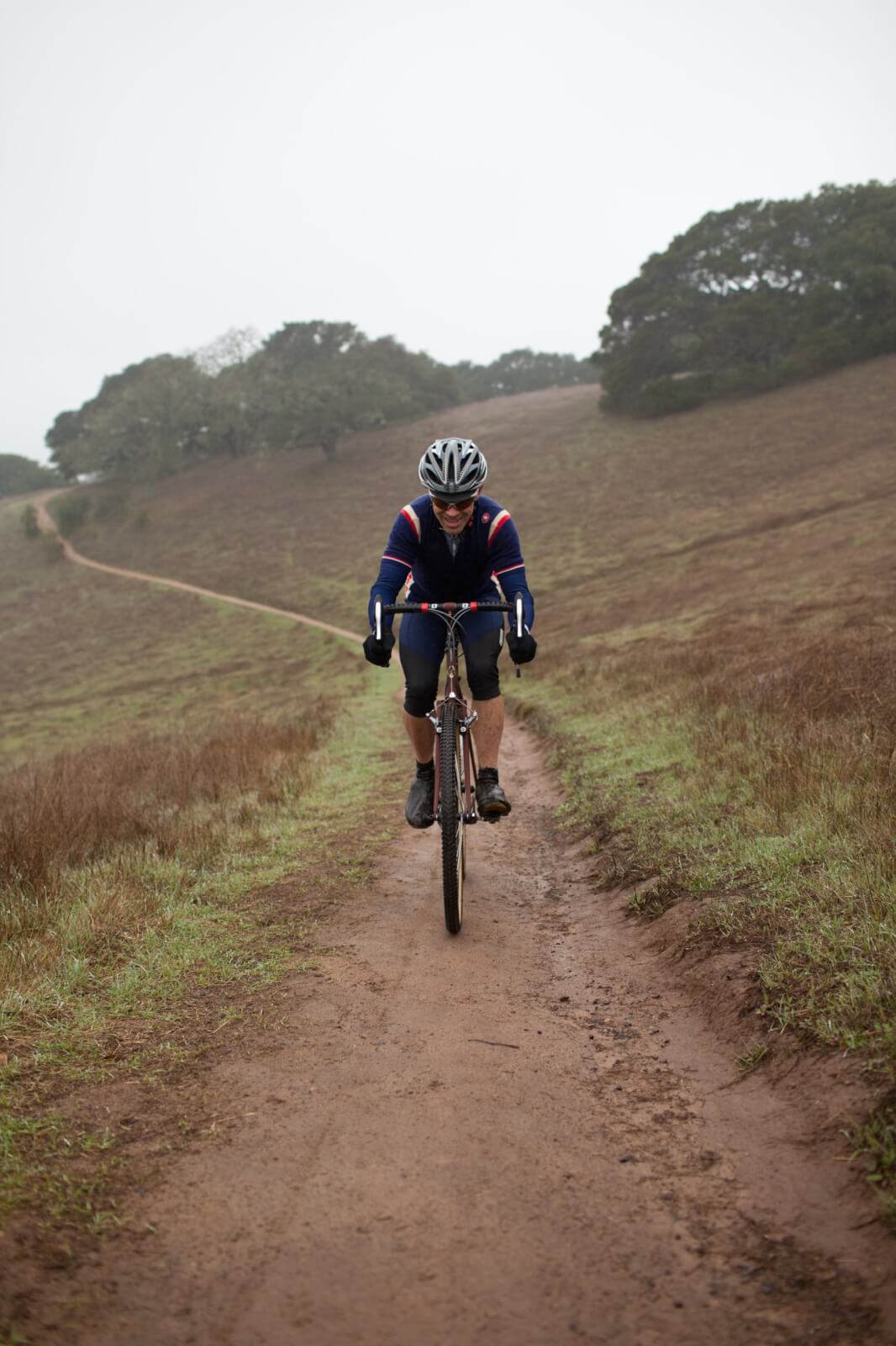 Outdoor recreation 4 Cyclist on muddy trail in fog