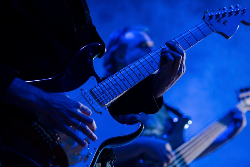 Electric guitarists performing on stage