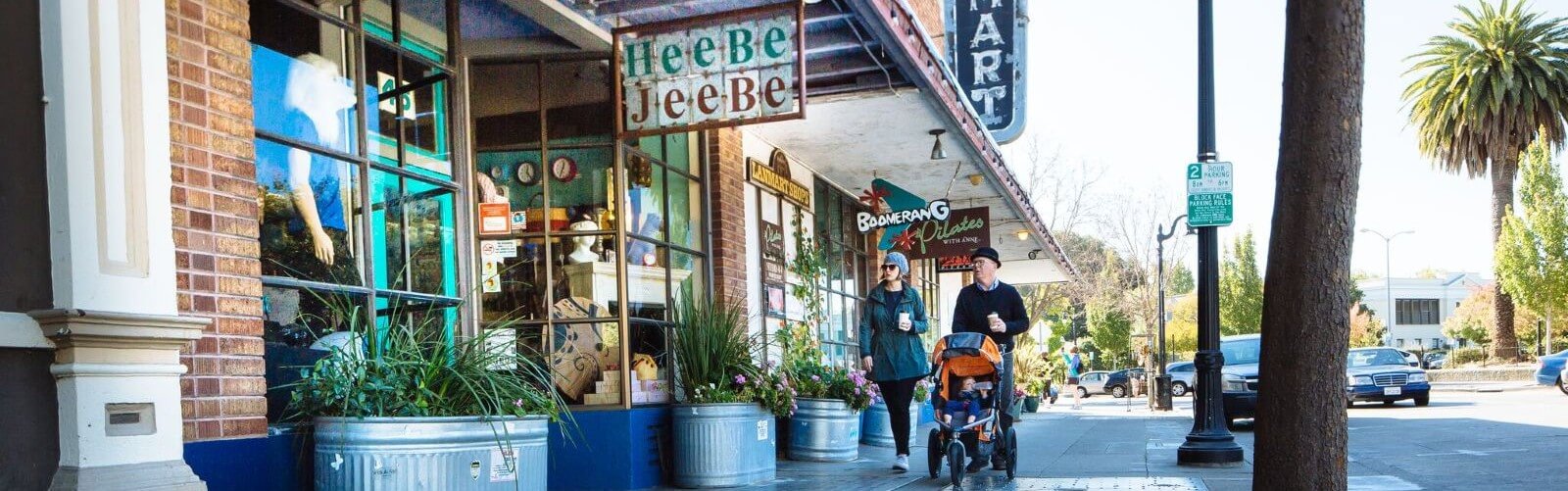 Shops and people on the sidewalk.
