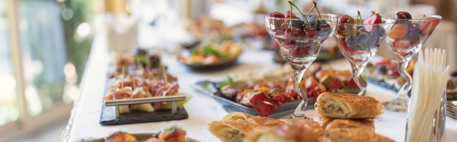 Elegant wedding caterers buffet with various dishes.